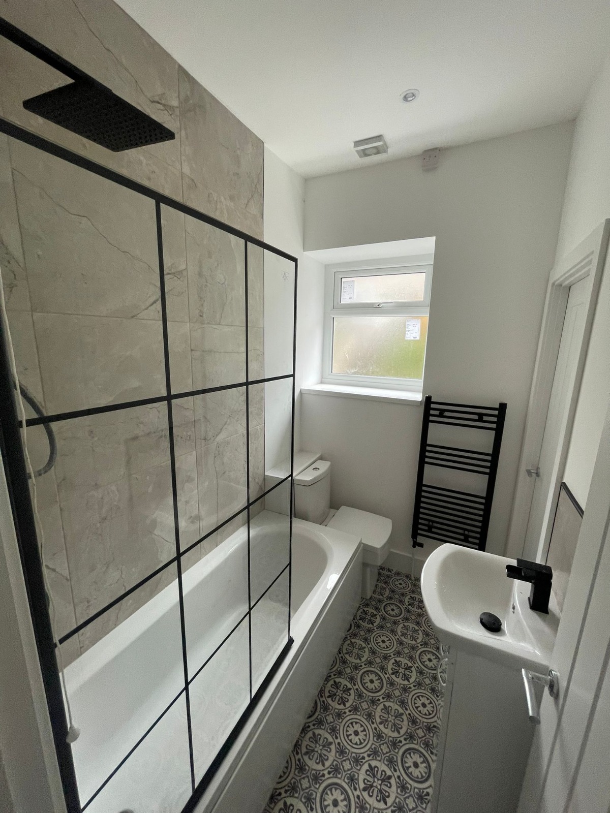 Sycamore Bathrooms feature installation with crittall shower screen
